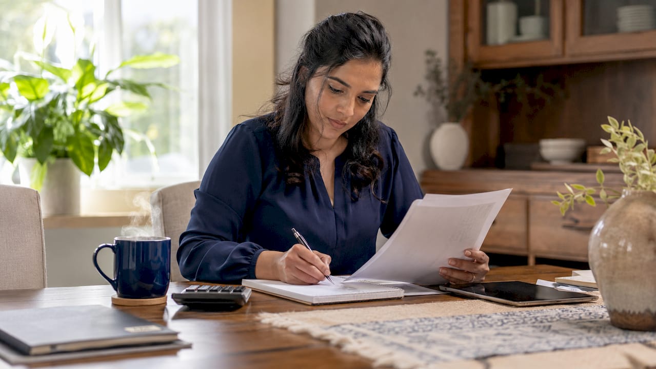Homebuyer reviewing mortgage pre-qualification forms
